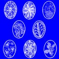 Vector illustration. Big set of drawn Easter eggs with floral pattern on a blue background. Royalty Free Stock Photo